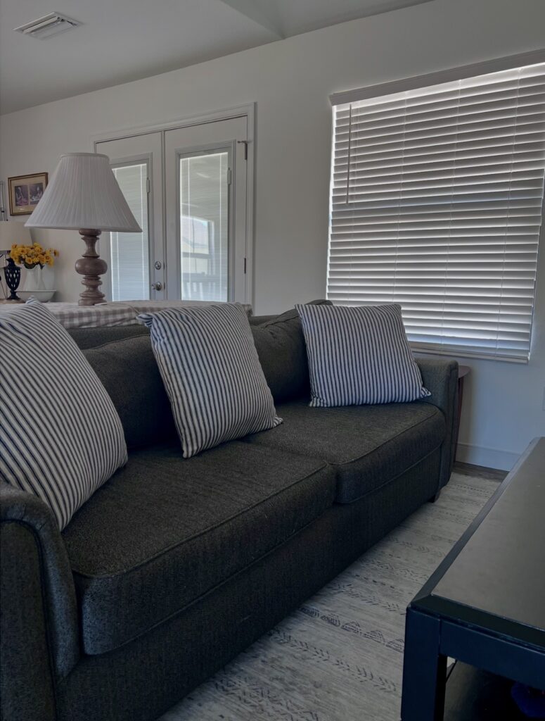 tidy cozy sofa in a calm home environment showing peaceful homemaking life