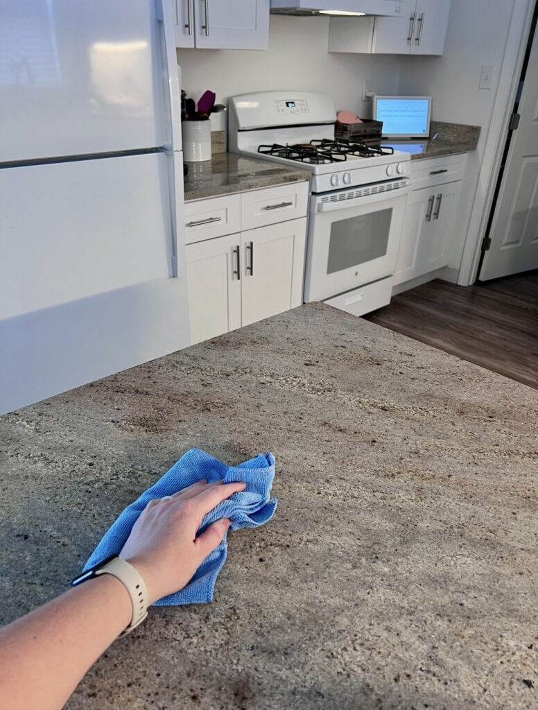 cleaning kitchen counter daily homemaking routine stay at home mom cleaning habit