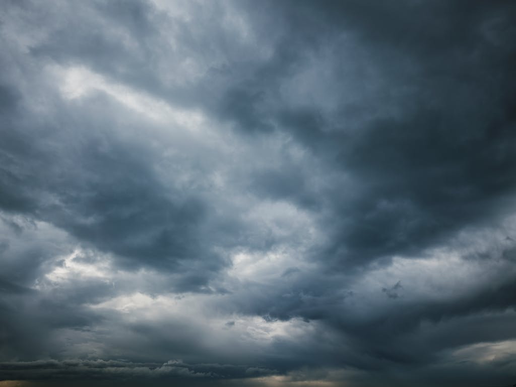 Moody sky with thick storm clouds, capturing the essence of an approaching storm.