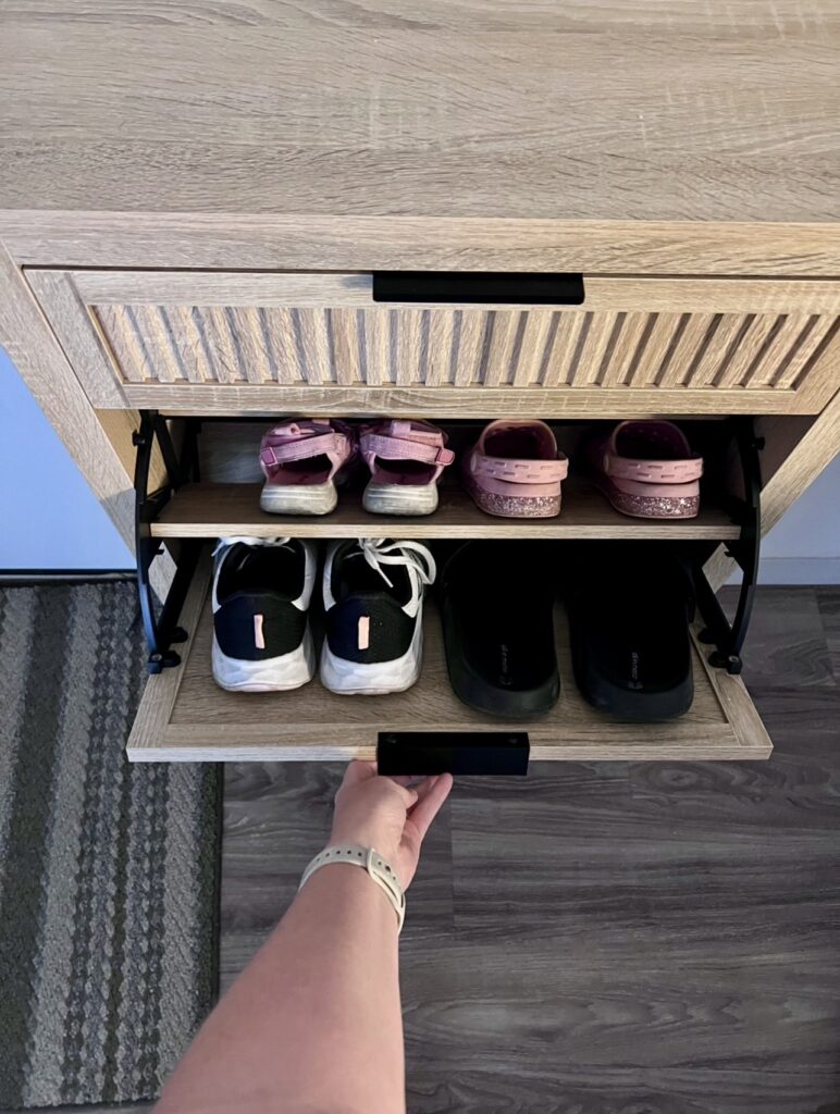 Organized family shoe storage near the front door to simplify busy mornings and daily routines.
